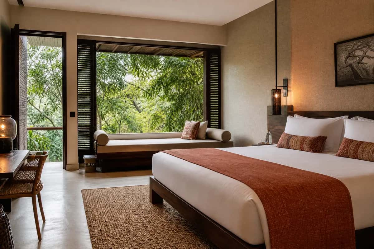 Fictional Canopy King room with a leafy outlook and daybed